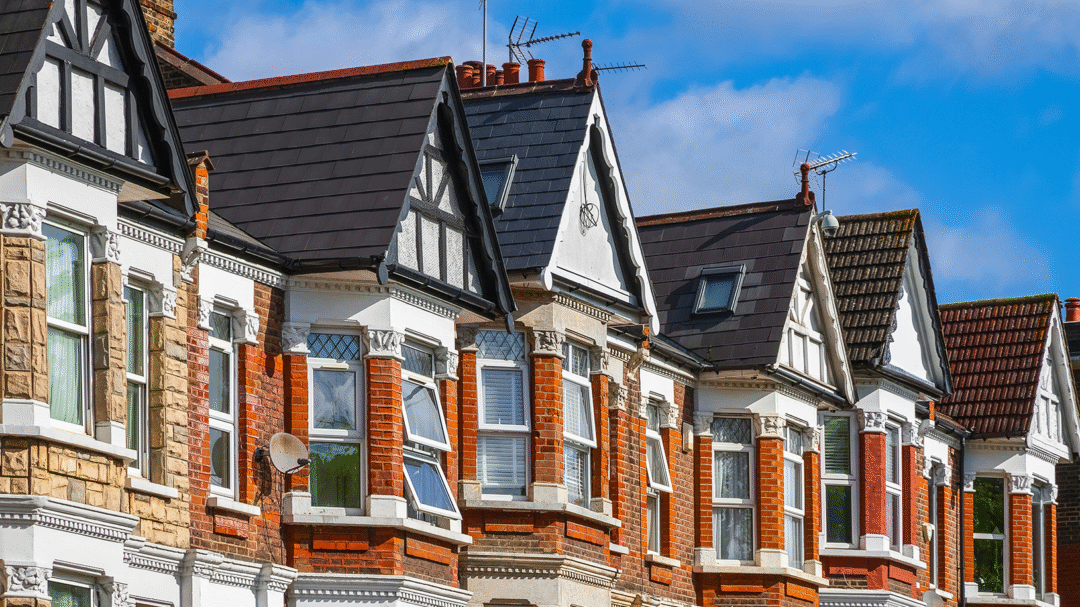 Row of red-brick terraced houses in the UK, representing Premier Contractors’ property maintenance and roofing services