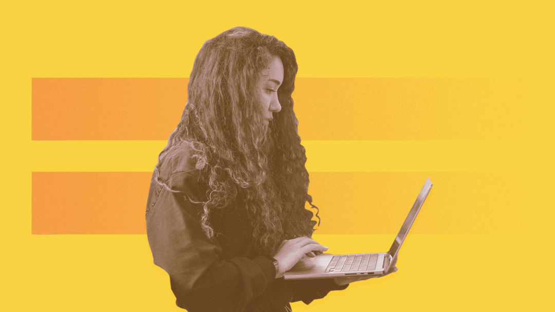 Person working on a laptop against a yellow background, representing Bing Ads management and digital marketing