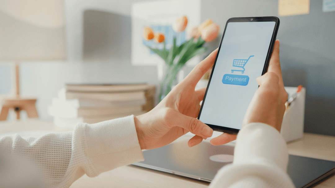 Person using a smartphone to make an online payment, representing eCommerce shopping and digital transactions