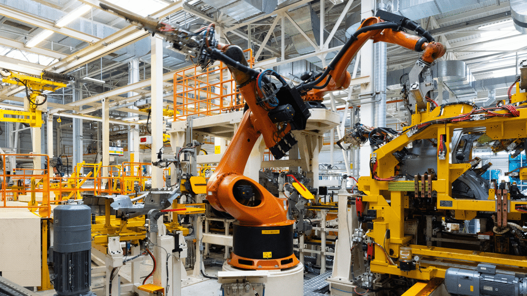 Industrial robotic arm operating on an automated production line in a modern manufacturing facility