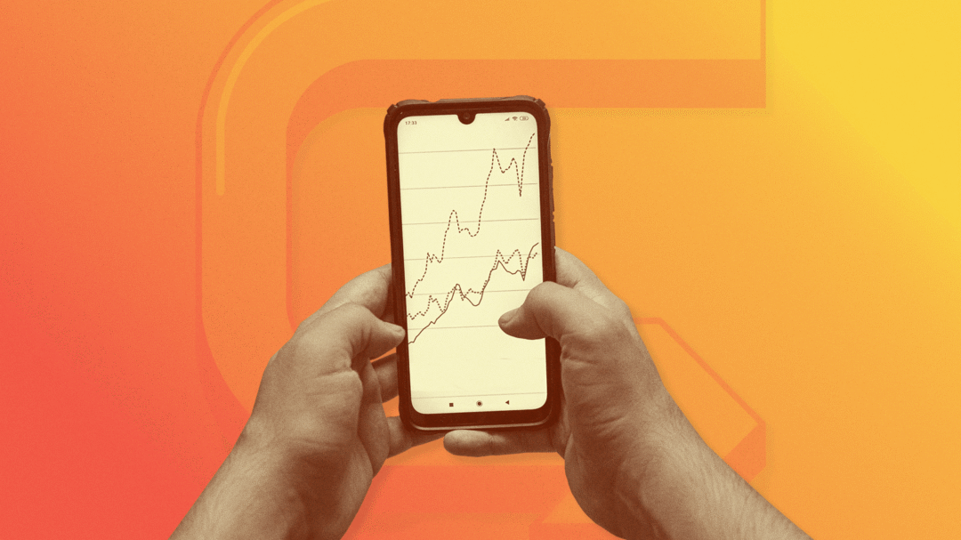 Hands holding a smartphone showing upward-trending analytics graph, symbolising digital marketing growth and performance results