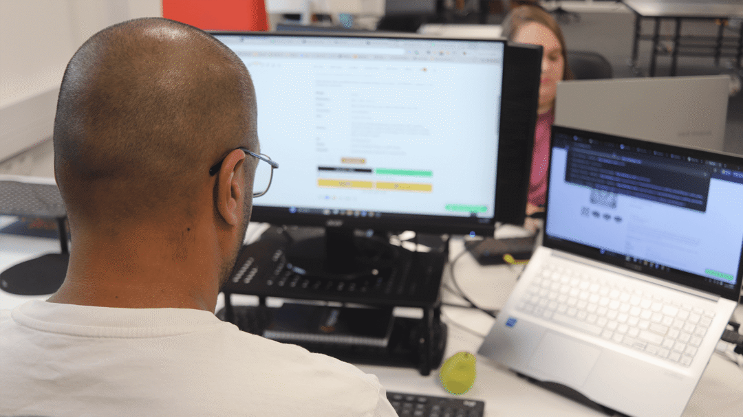 Repeat Digital team member working on their laptop