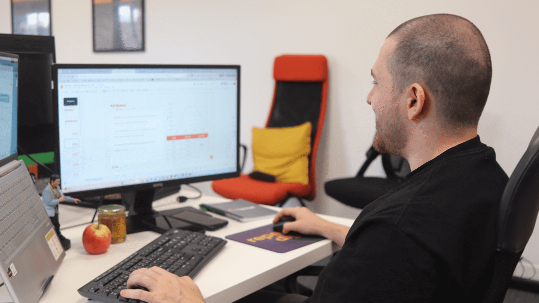 Repeat Digital team member working on their laptop